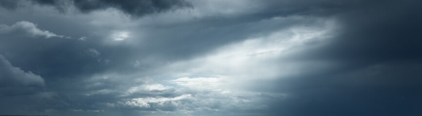 Wall Mural - Dark ornamental clouds. Dramatic sky. Epic storm cloudscape. Panoramic image, texture, background, graphic resources, design, copy space. Meteorology, weather, thunderstorm. hurricane concepts