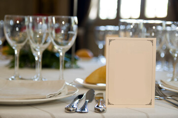 Festive event table decoration with isolated invitation paper