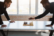 © xartproduction - two male businessmen, rivals are playing chess. Strategy and rivalry.