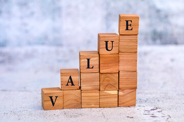 Value word written on wooden cubes . Business concept