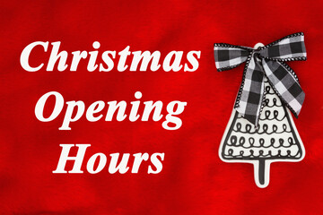 Wall Mural - Christmas Opening Hours message with tree with a bow