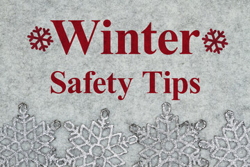 Wall Mural - Winter Safety Tips message with gray snowflake border