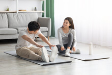 Cute Asian Couple Exercising At Home, Copy Space