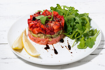 Wall Mural - delicious salad with salted fish and avocado on a plate