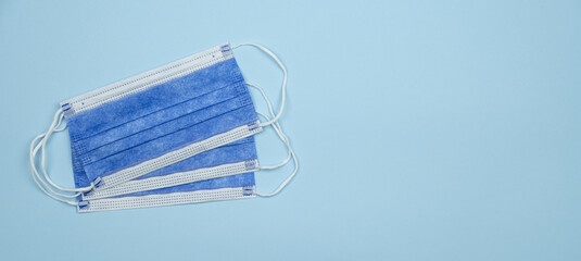 Poster - Top view of three face masks isolated on light blue  background