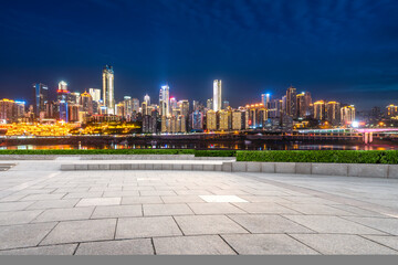 Wall Mural - cityscape and skyline of downtown near water of chongqing at night