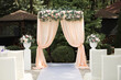 Beautiful wedding arch for an exit ceremony with flowers