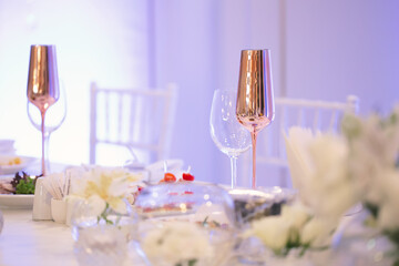 Wall Mural - Table at a luxury wedding reception. Beautiful flowers on the table. Serving dishes, glass glasses