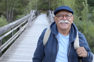 Wall Mural - Senior man in rustic background