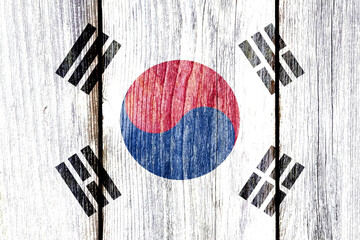 Poster - Grunge pattern of South Korea national flag isolated on weathered wooden fence board.