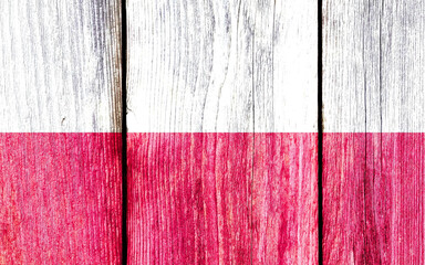 Poster - Grunge pattern of Poland national flag isolated on weathered wooden fence board.