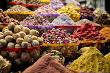Close-up Shot Of Different Colorful Spices In Bowls For Sale At The Market In Dubai