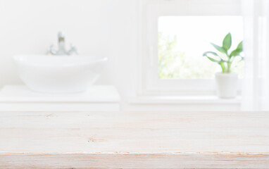 Wall Mural - old wooden tabletop on blur bathroom sink and window background