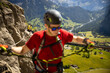 © lightpoet - Young people on a via ferrata route in Swiss Alps