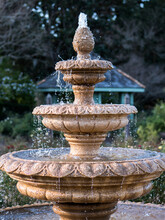 Vertical Shot Of A Beautiful Water Fountain In A Park