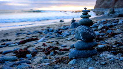 Poster - Closeup shot of stacked rocks on a beach