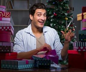 Wall Mural - Man with many christmas gifts in boxes