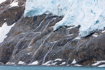 Poster - Southern Ocean, South Georgia, Drygalski Fjord. Meltwater flows from the melting foot of the Resting Glacier.