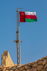 Canvas Print - Middle East, Arabian Peninsula, Oman, Muscat, Muttrah. Omani flag flying in Muttrah.