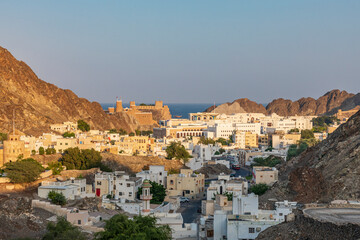 Sticker - Middle East, Arabian Peninsula, Oman, Muscat. Sunset view of a neighborhood in the hills of Muscat.