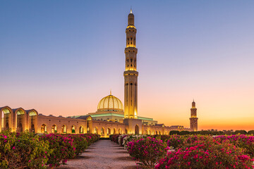 Wall Mural - Middle East, Arabian Peninsula, Oman, Muscat. Sunset view of the Sultan Qaboos Grand Mosque in Bawshar.
