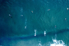 Aerial View Of Surfers Riding The Waves In Newport Beach, California