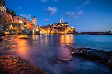 Canvas Print - Europe, Italy, Vernazza. Landscape with village and ocean at sunset.