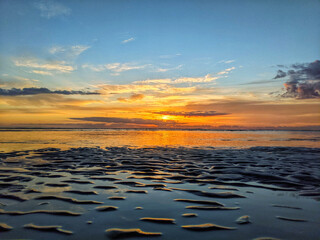 Poster - Beautiful scenery of the seashore with a sunset background