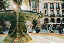 Beautiful Historic Fountain In Plaza Real In Barcelona, Spain. Famous Square In Gothic Quarter. Popular Tourist Attraction.