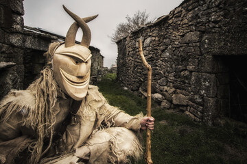 Poster - Closeup shot of an ancestral sculpture at a carnival in Portugal