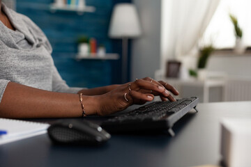 Poster - Close up of hands typing on keyboard to work on business project with computer at desk. Woman working with modern device and technology at home, browsing online internet webiste.
