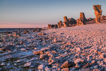 Poster - Sweden, Faro Island, Langhammars Area, Langhammar coastal limestone rauk rock, sunset