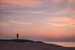 Sweden, Scania, Malmo, Riberborgs Stranden beach area, woman watching sunset