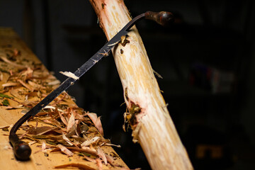 Poster - Closeup of woodworking draw knife leaning on wood