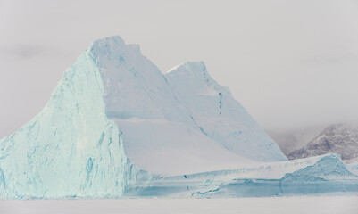 Poster - Icebergs in front of Storen Island, frozen into the sea ice of the Uummannaq fjord system during winter. Greenland, Danish Territory