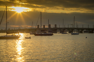 Wall Mural - Yachts and boats sailing in the water during the sunset