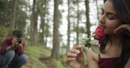 Poster - A Slow-motion of a South Asian romantic couple hugging each other for a photoshoot in the green park