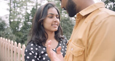 Poster - A Slow-motion of a South Asian romantic couple hugging each other for a photoshoot in the green park