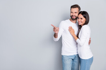 Wall Mural - Photo of lovely millennial brunet couple index promo wear white shirt jeans isolated on grey background