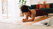 © (JLco) Julia Amaral - Healthy woman holding plank position at home
