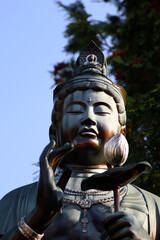 Maitreya statue under the bright blue sky