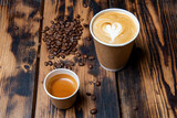 Espresso and lungo coffee with coffee beans on a wooden background