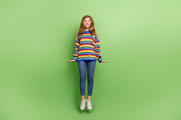 Poster - Full length body size view of attractive funky girlish cheerful girl jumping good mood isolated over bright green color background