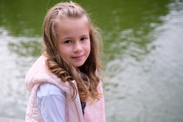 Wall Mural - Portrait of pretty child girl outdoors