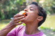 © paltu - Portrait of a young rural boy having ice cream