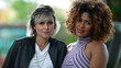 © Marco - Two diverse women portrait faces looking at camera