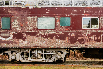 Sticker - Old, weathered train railcar. Rusty train. Side view.