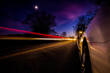 Canvas Print - Long exposure shot of car lights on a highway at night