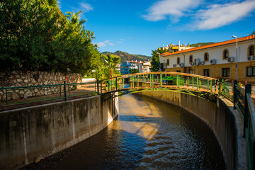 Wall Mural - MARMARIS, TURKEY: Canal with water on the street of the city of Marmaris on a sunny day.