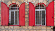 Interesting Old Red Shuttered Arched Windows In Jerusalem In Israel
